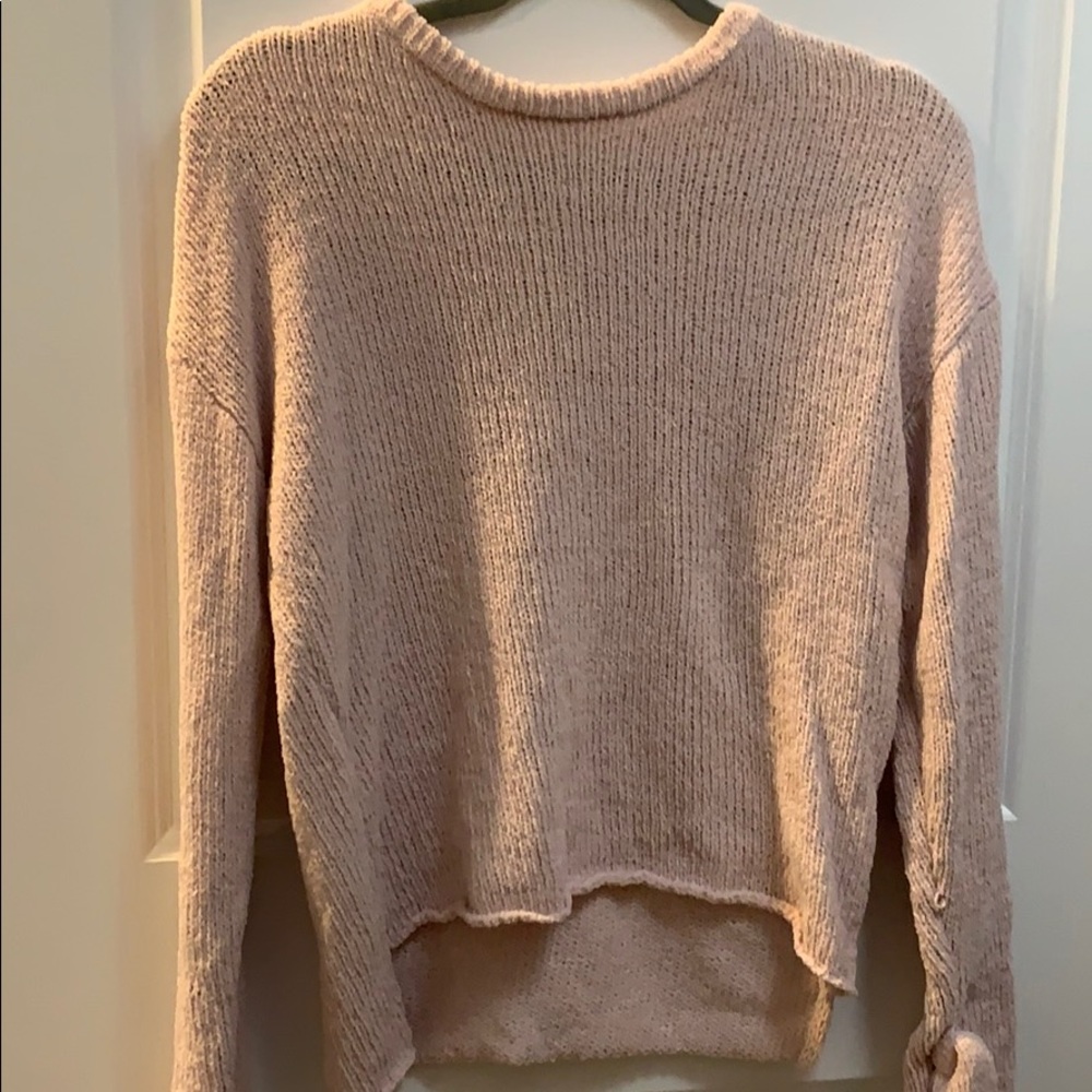 Pink sweater with bows on the sleeves